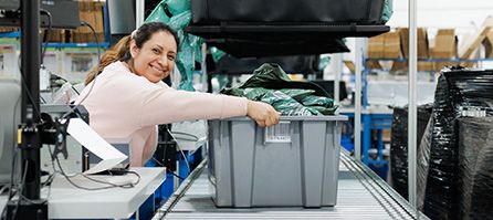 A Woman inspecting a crate